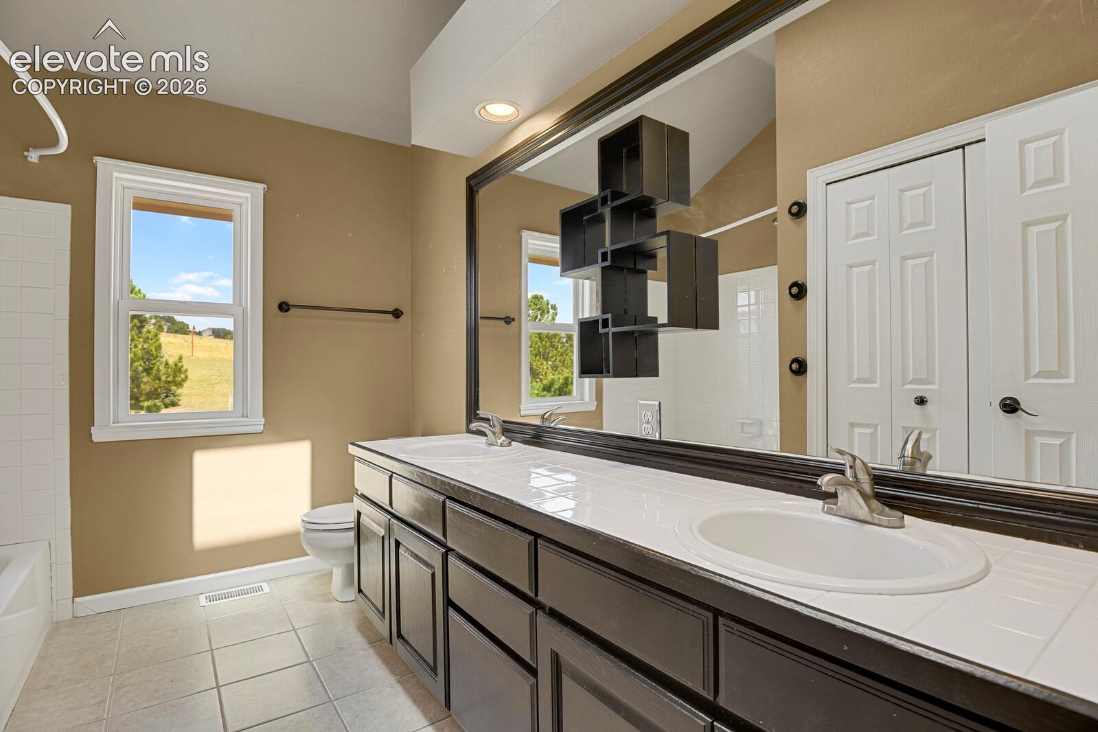 Large linen closet and dual sinks