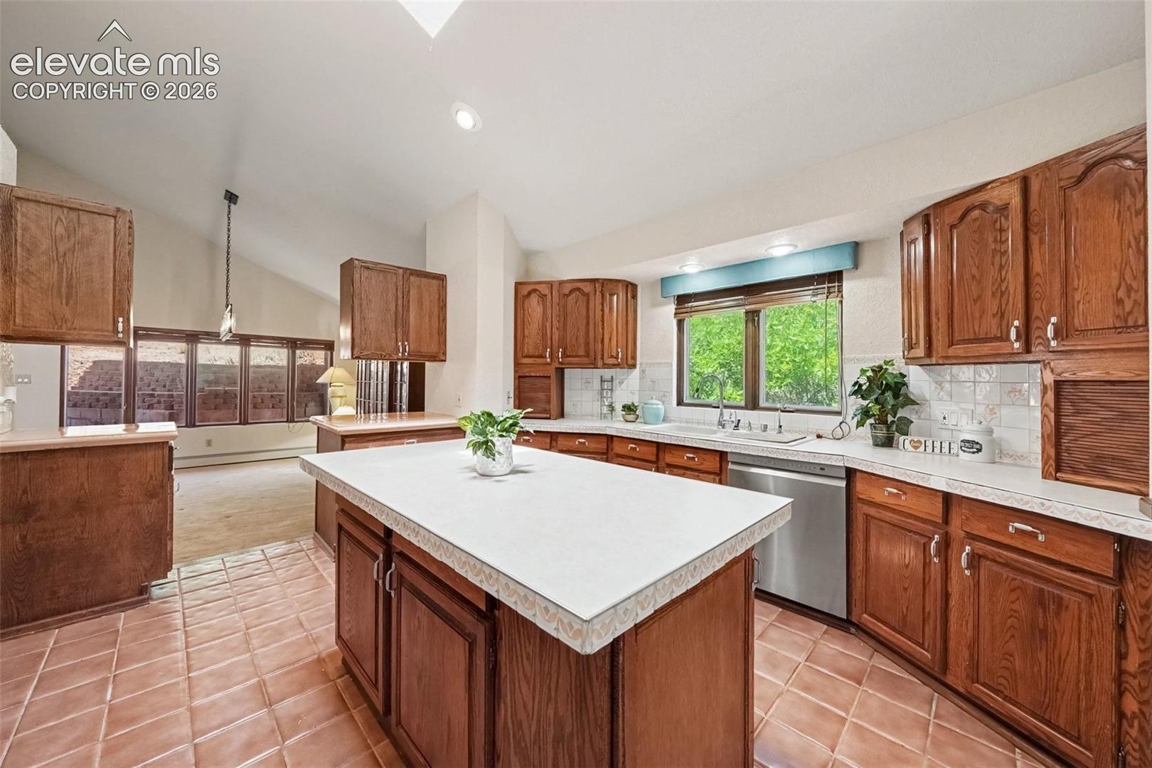 Bright and distinctive kitchen featuring a skylight that fills the space with natural light