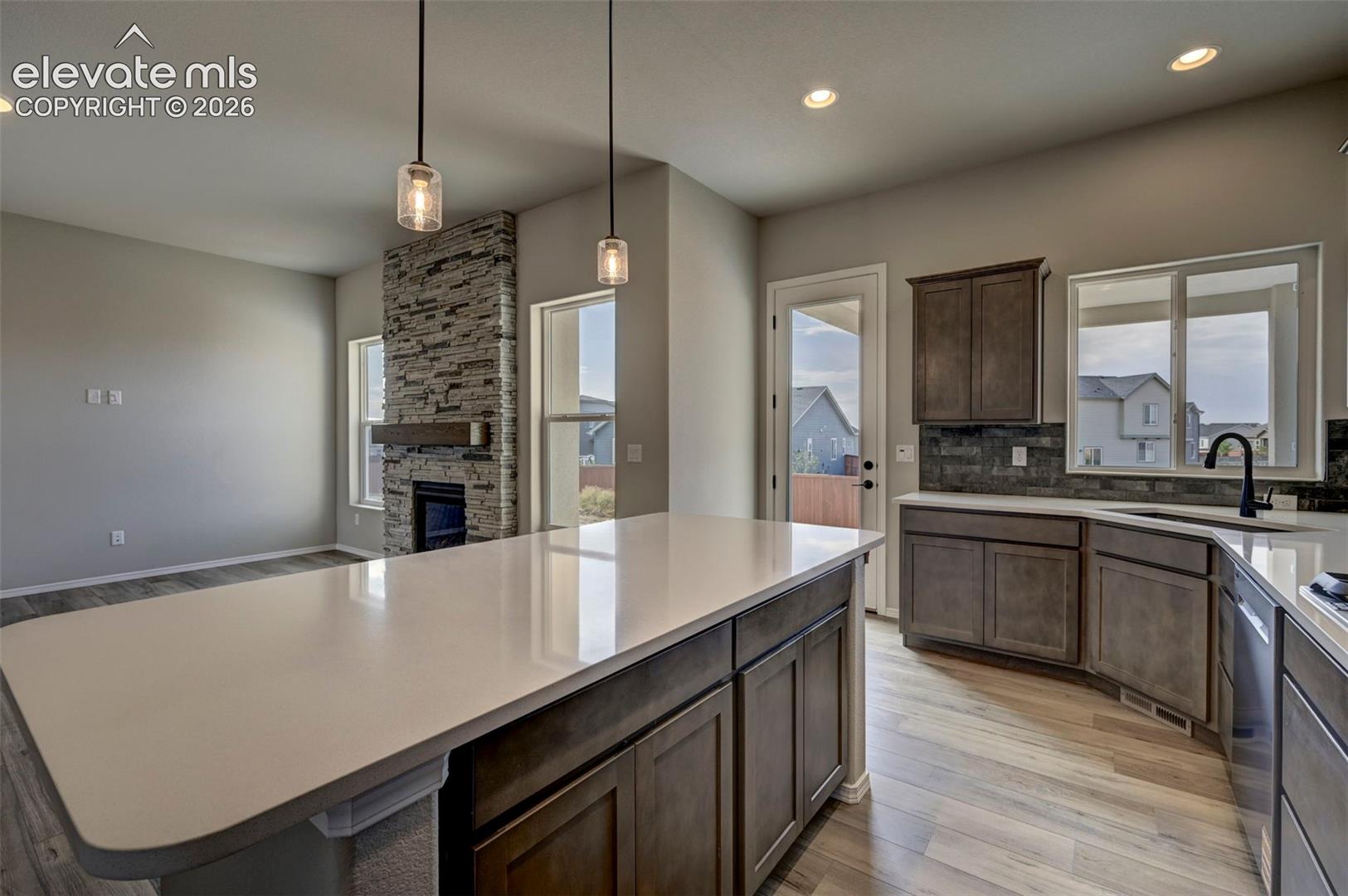 Kitchen open to living room and patio access