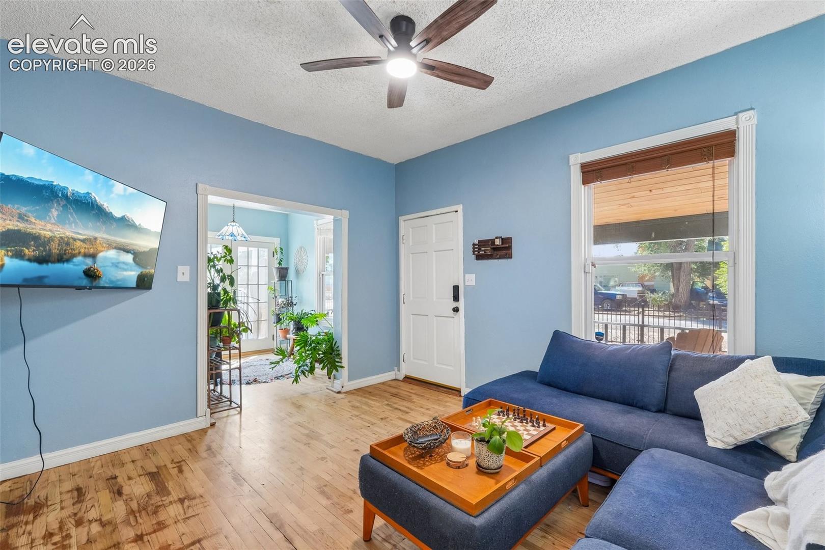 Living room looking to sunroom with walk out