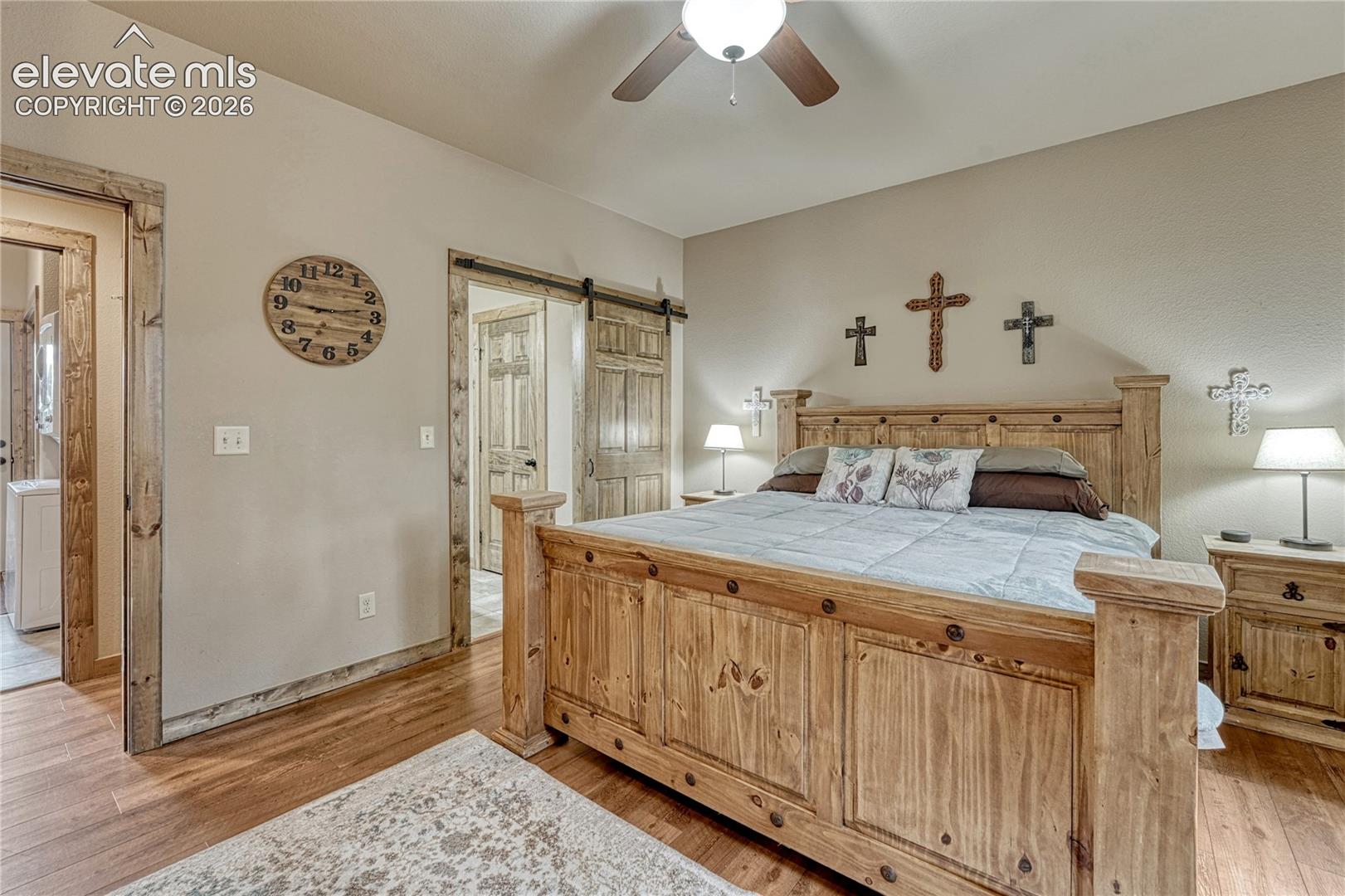 Wood-finish flooring, wood-framed doorways, sliding barn door 