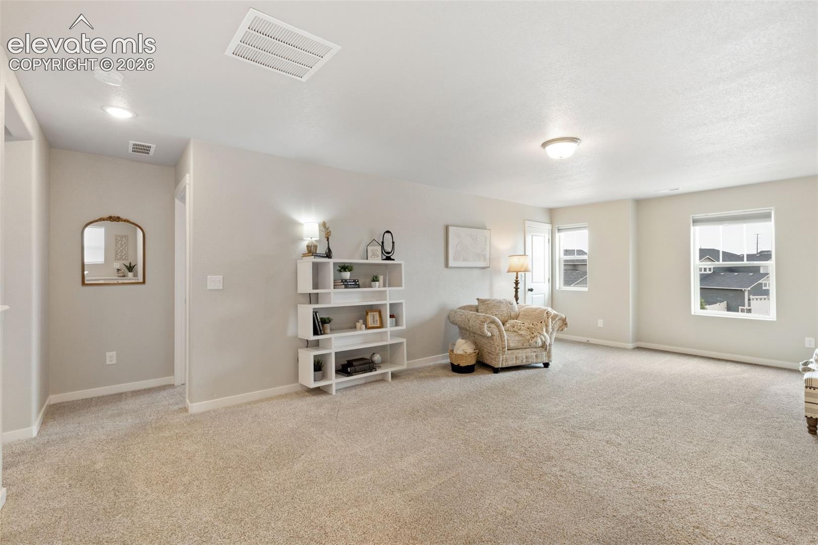 Spacious area useful for a media space, play room & more. Large closet in this area adds additional storage.