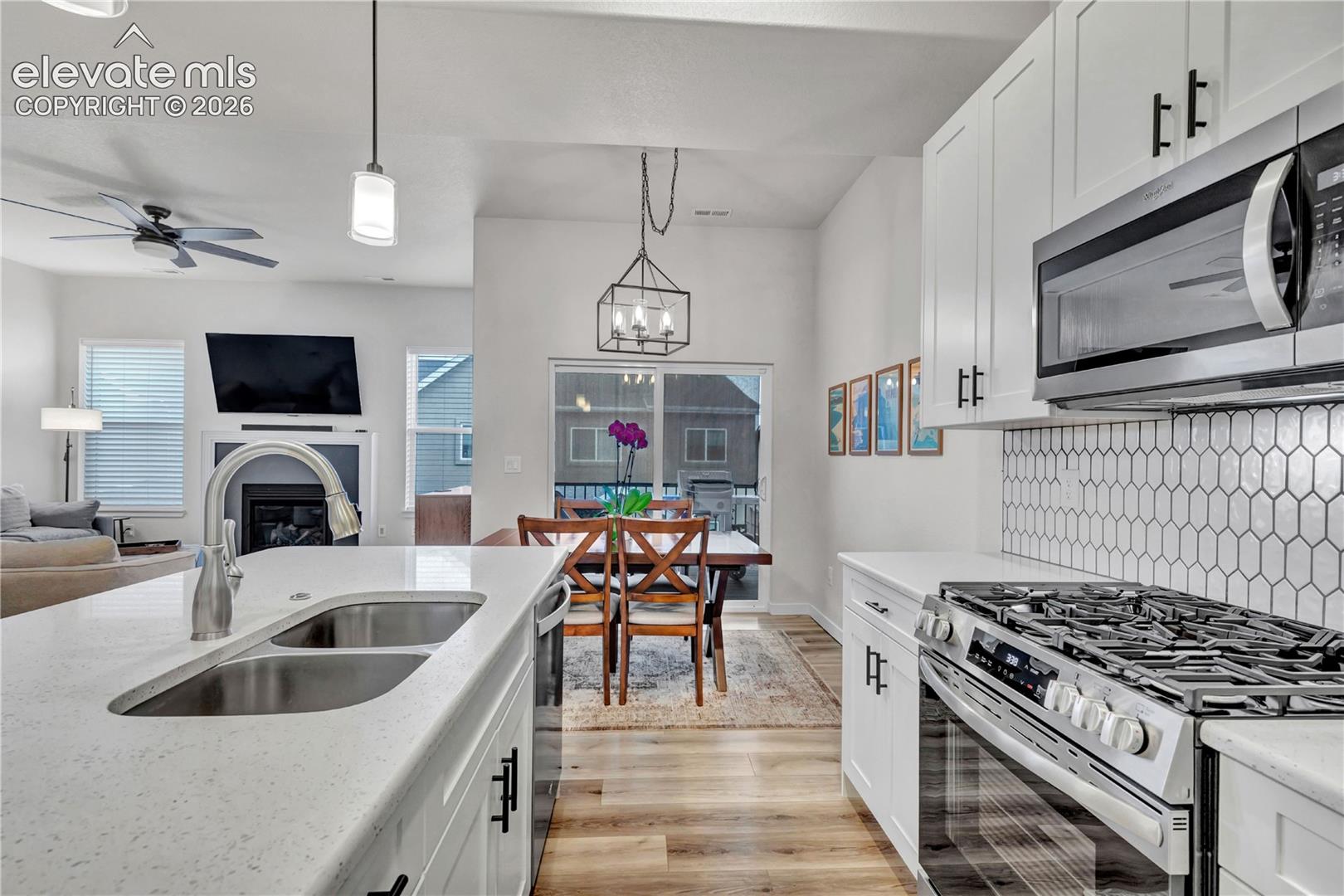 Kitchen island with an undermount double-basin sink and gooseneck faucet