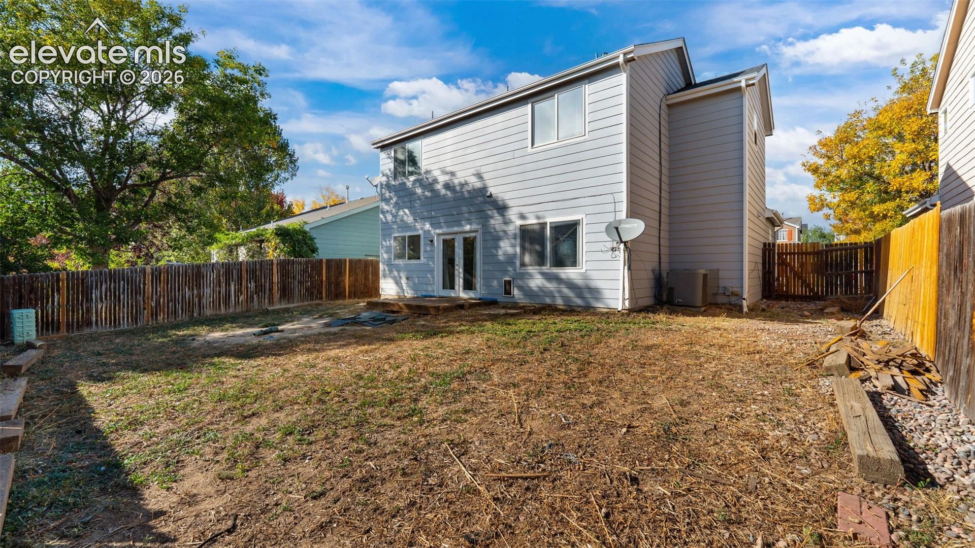 Two-story exterior with light gray siding