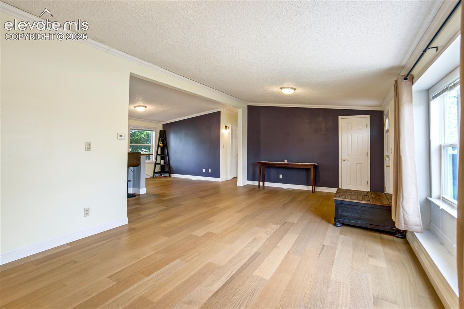 Large front window creates a bright and welcoming atmosphere.