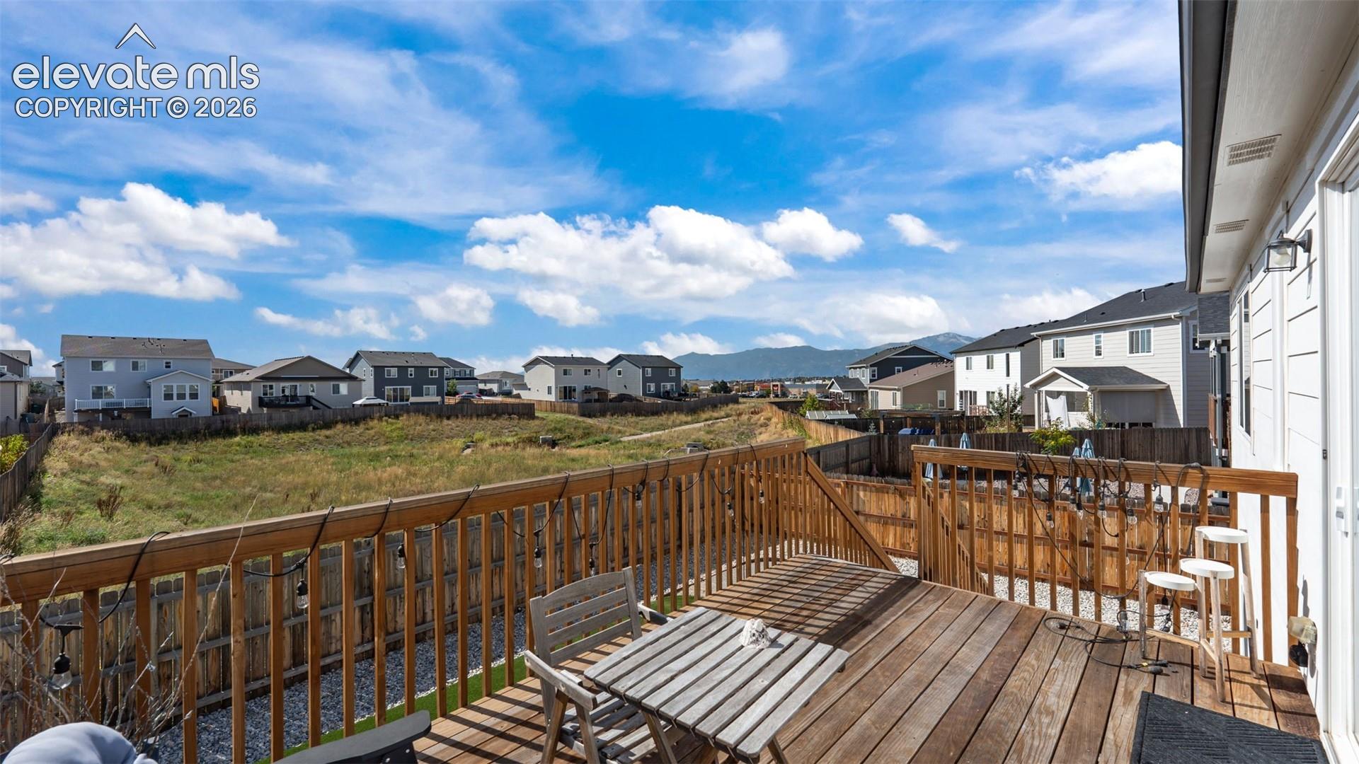 Expansive wood deck with a full wood railing and built-in privacy fence