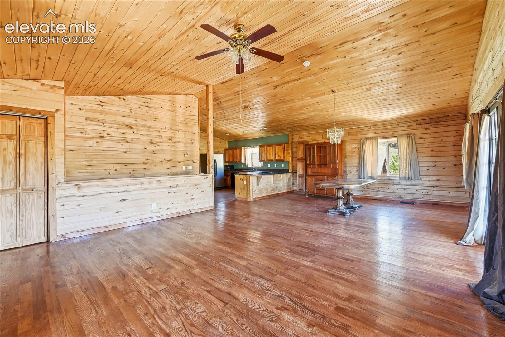 Wood-finish flooring, wood plank walls, and wood plank ceiling