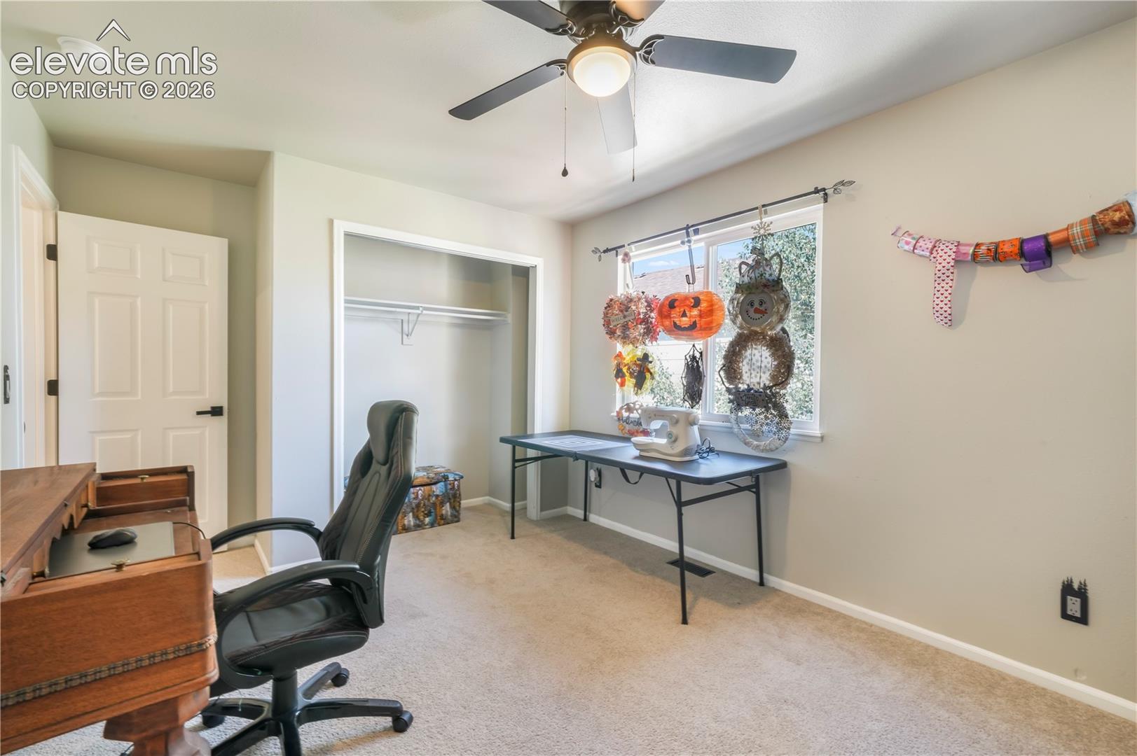Upstairs 5th bedroom currently staged as an office/craft room