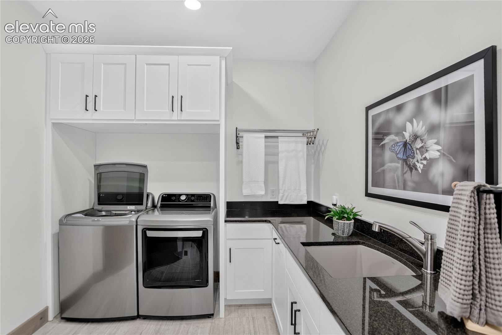 Laundry room w/ abundant counter & cabinet space