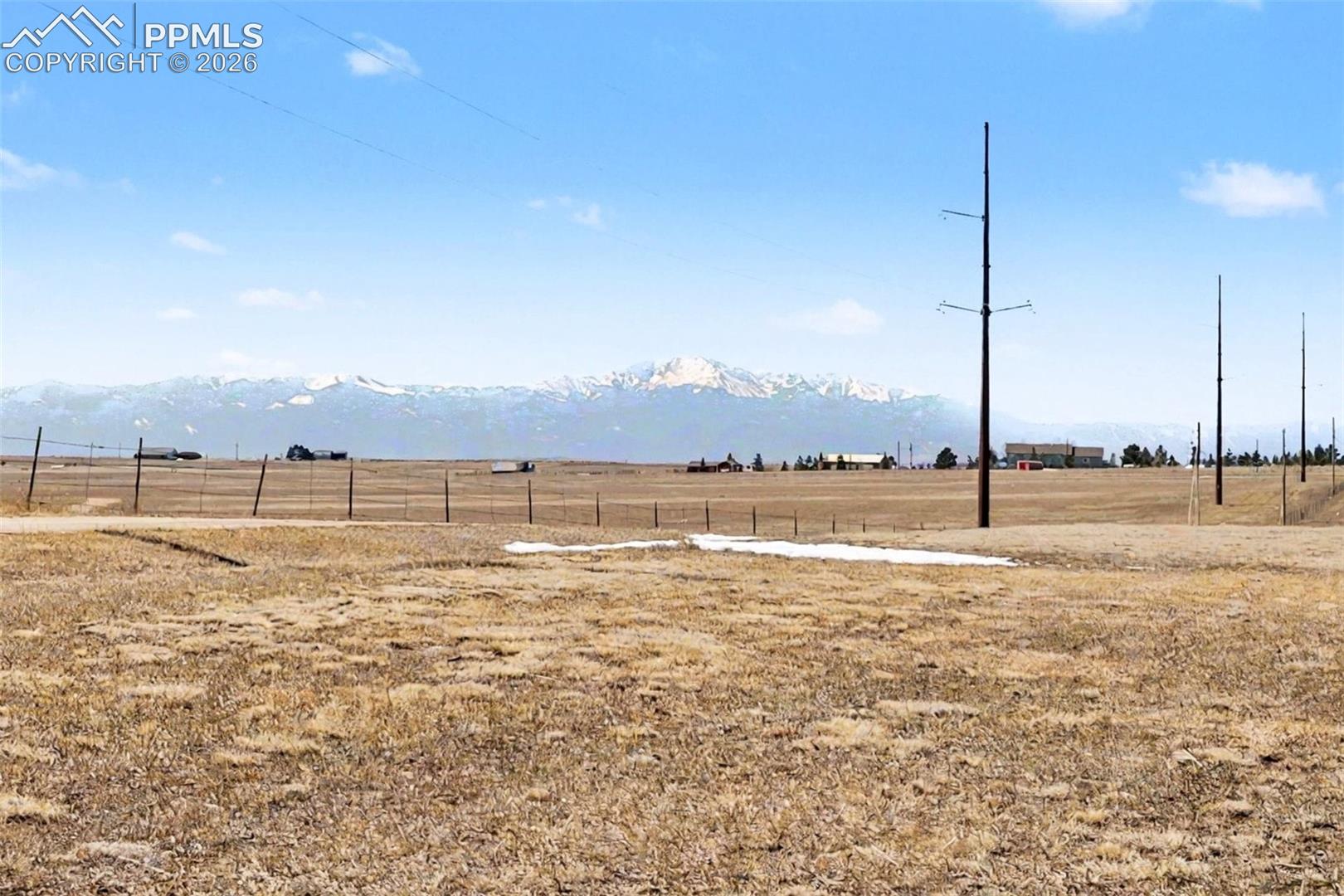 Ground-level view showing open terrain and surrounding countryside.