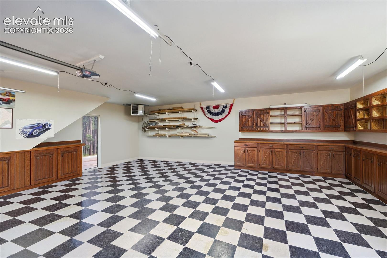 Detached Garage Heated with cabinets and Space for 3 Cars
