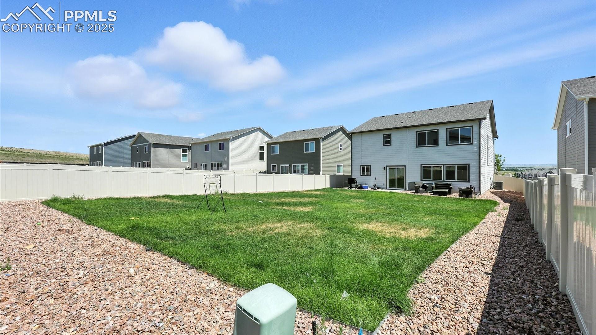 Fenced backyard with auto sprinklers and lots of room for the kids and pets to run and play.
