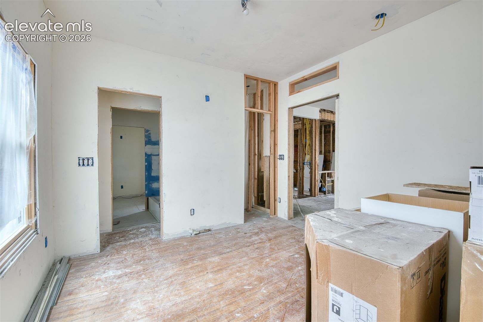 Opposite view of primary suite connected to Jack and Jill Bathroom. 