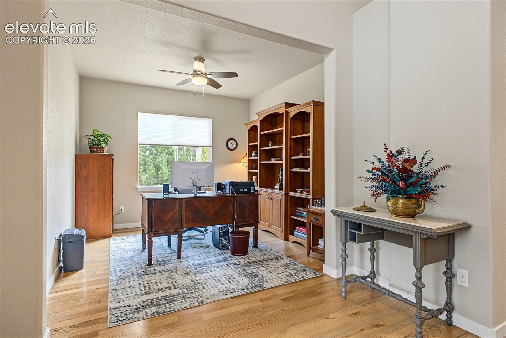 A private den just off the main living area offers a bright, comfortable space for a home office, reading room, or quiet retreat.
