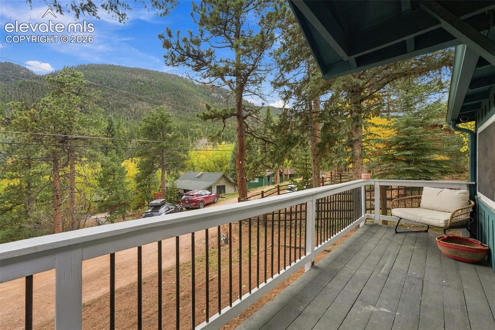 Covered exterior deck with the sounds of the creek across the street.