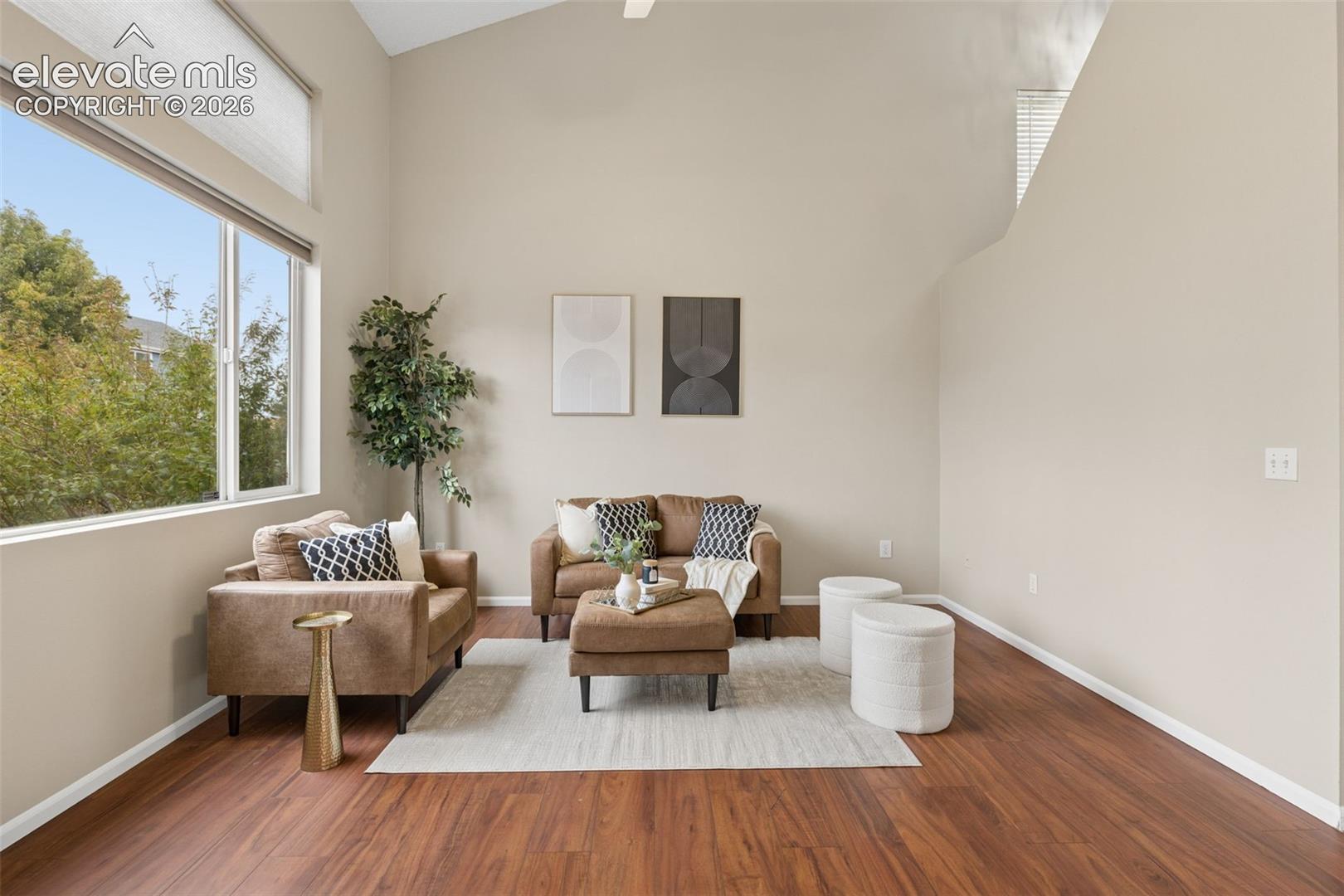 Vaulted ceilings, expansive windows, and wood-finish flooring