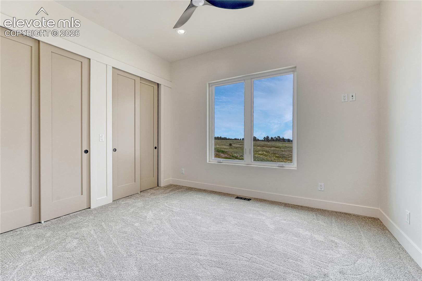 Second of two additional main level bedrooms...