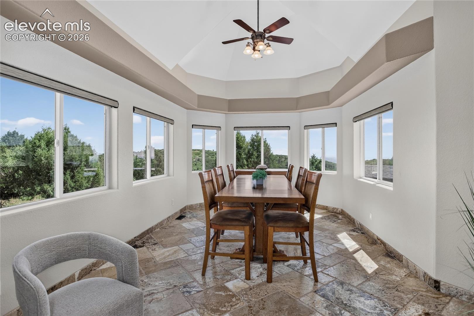 Adjacent sunroom with city views