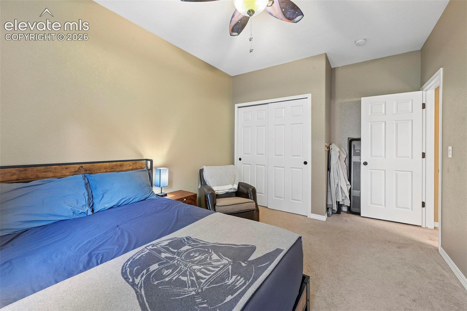 Recessed lighting, ceiling fan, neutral wall tones, and carpeted flooring