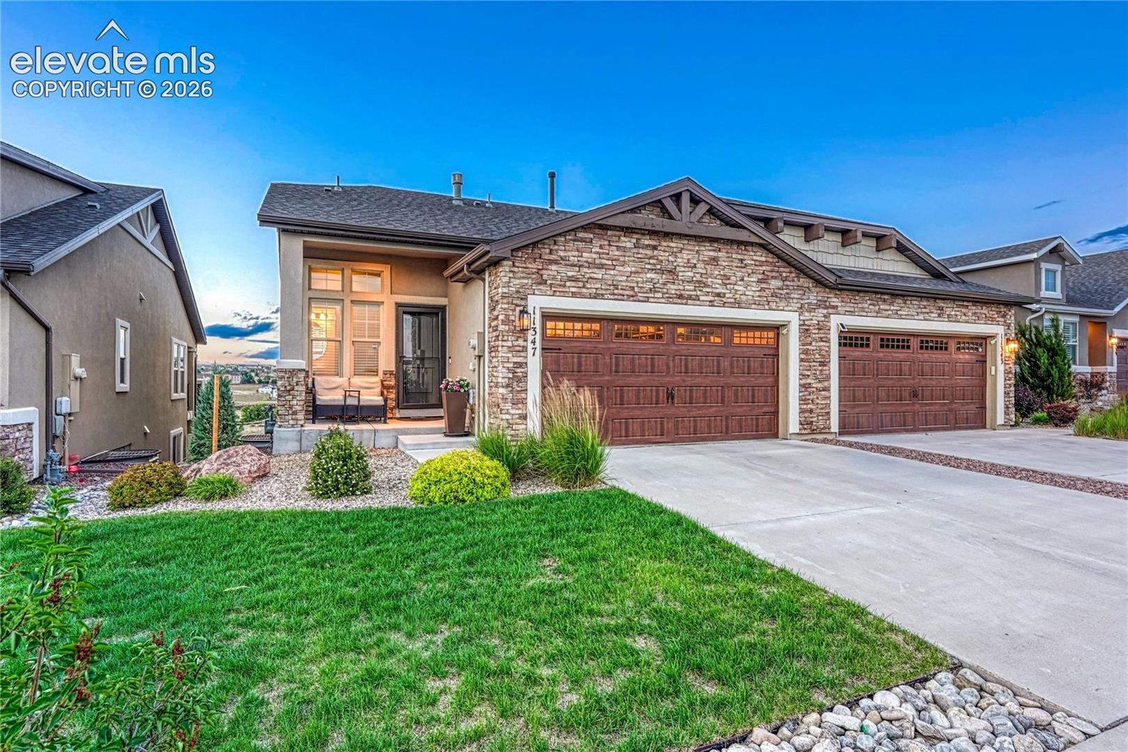 This charming patio home welcomes you with a beautiful stucco and stone exterior, manicured landscaping, and spacious attached garage.