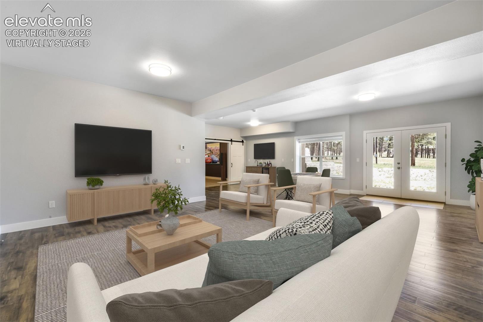 Huge family room for entertaining in basement virtually staged
