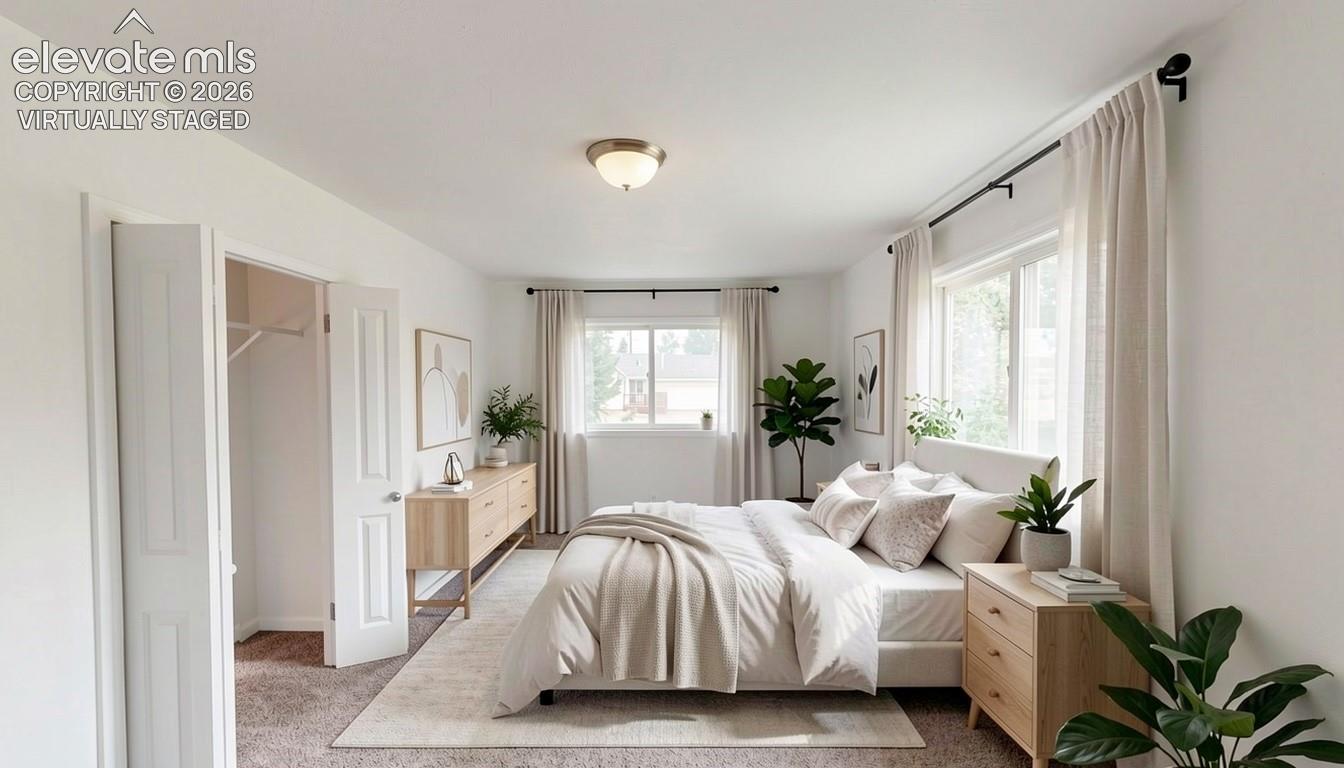 virtually staged.Recessed ceiling light fixture, twin windows with drapery rods, interior bi-fold door, and wall-to-wall carpeting