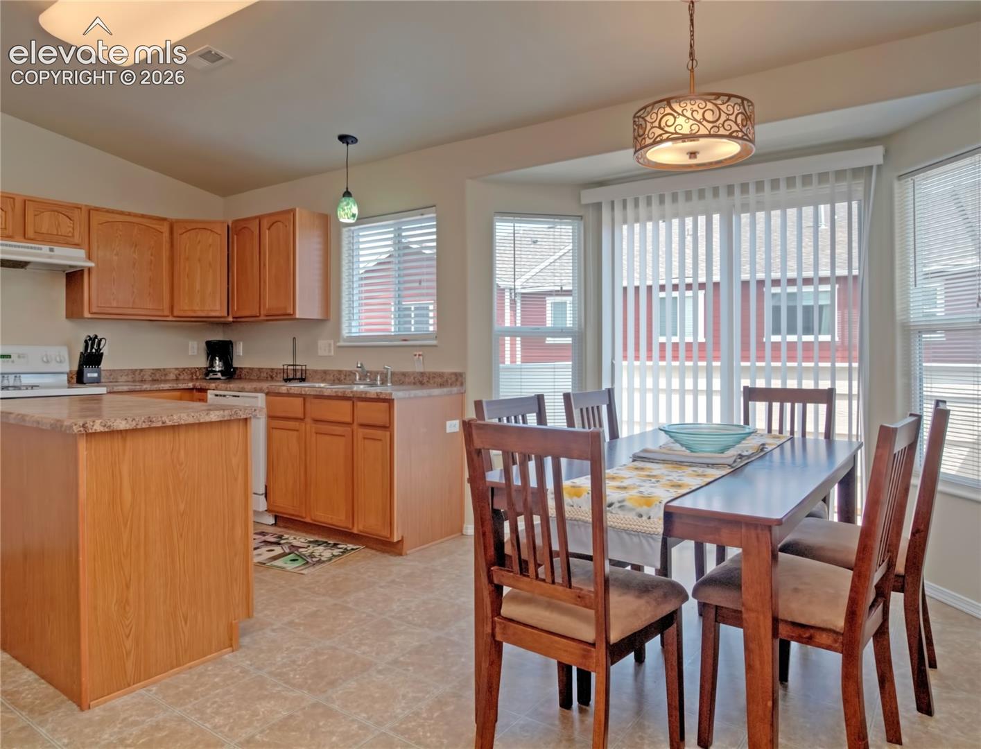 Kitchen a-dinning area new LVP floors and a walk out to balcony