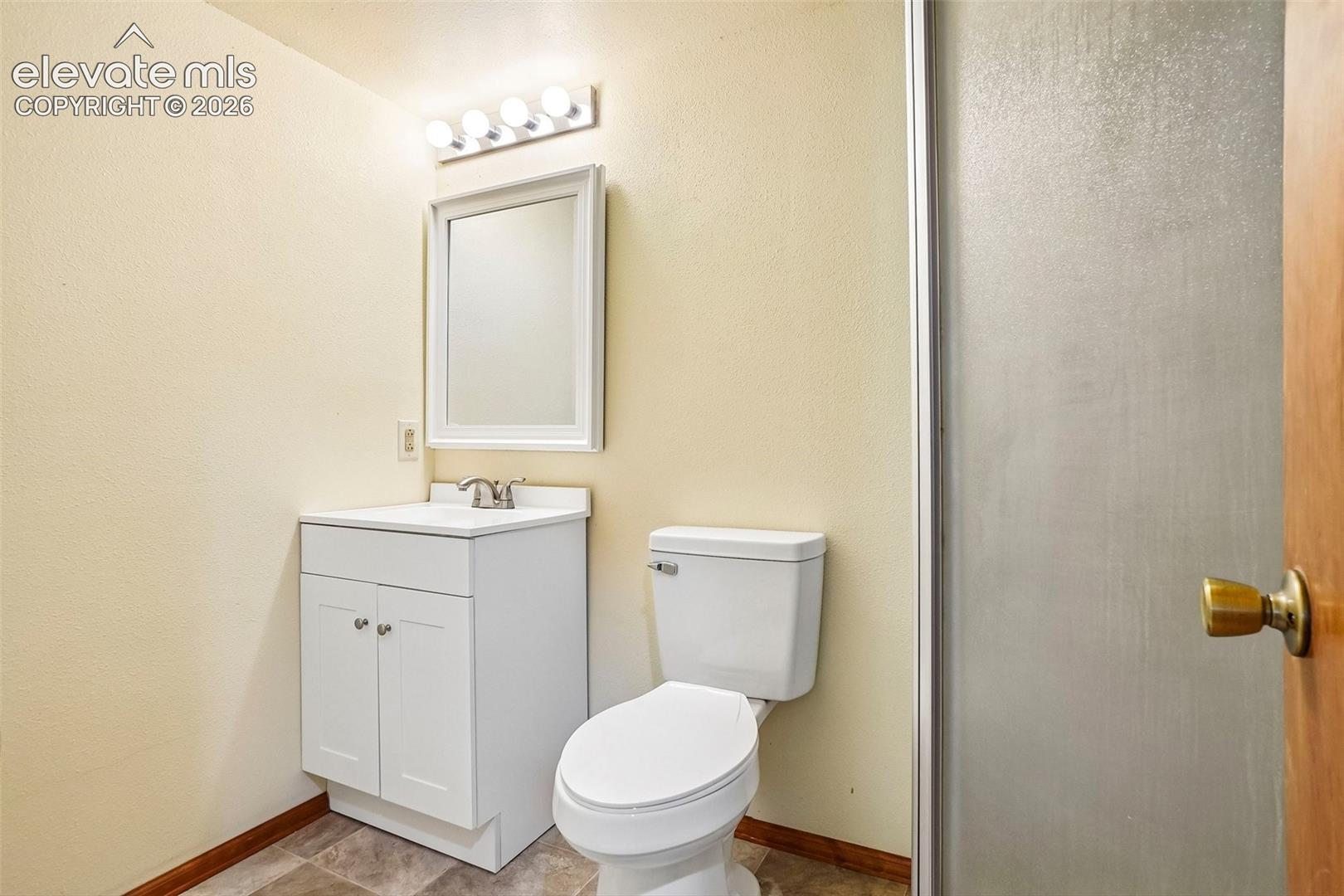 Basement bathroom has shower.