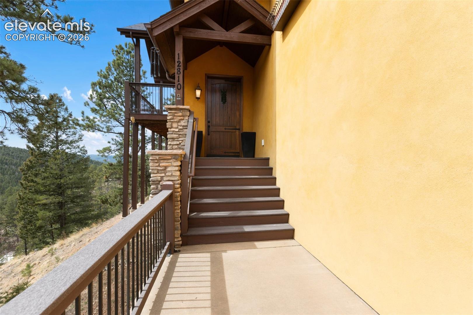 Entrance with 9 foot Teak Wood Door. A