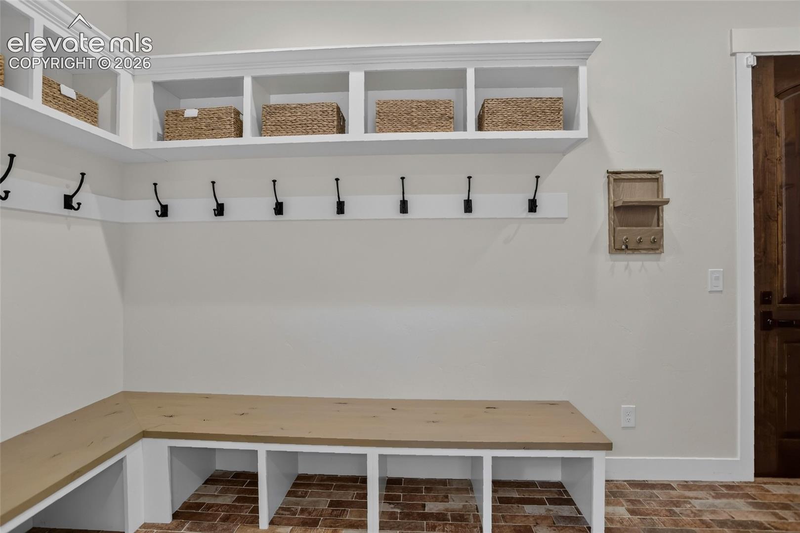 Mudroom w/ coat closet & storage