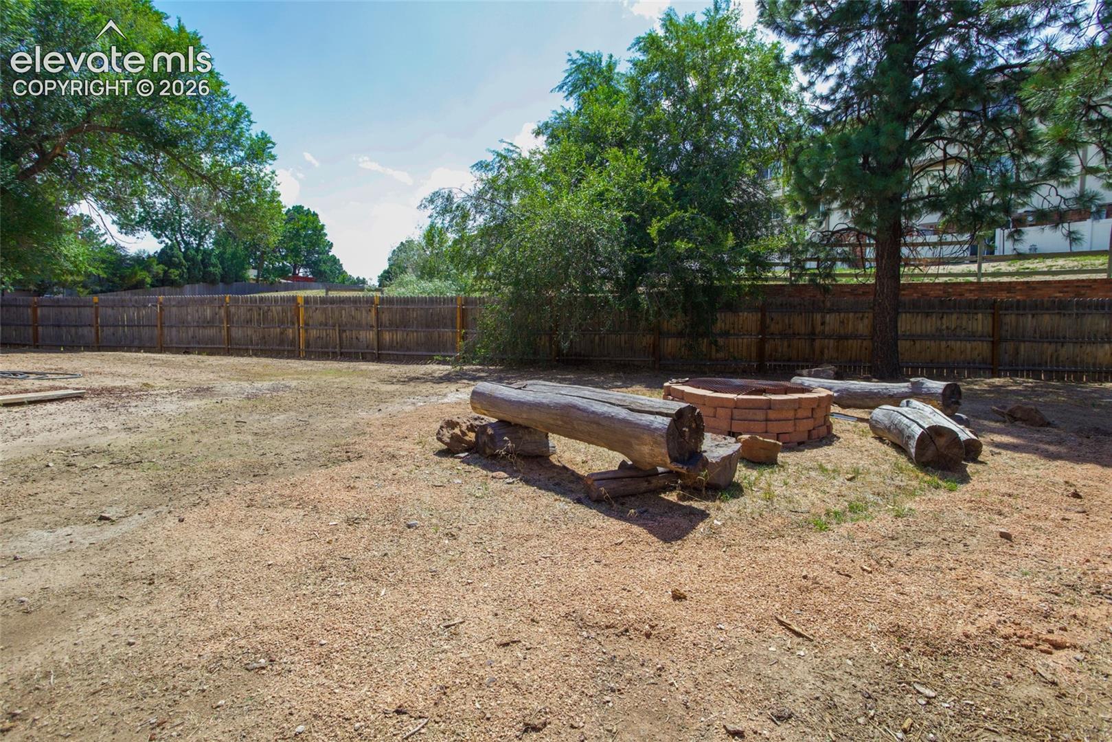 Fire pit and mature trees