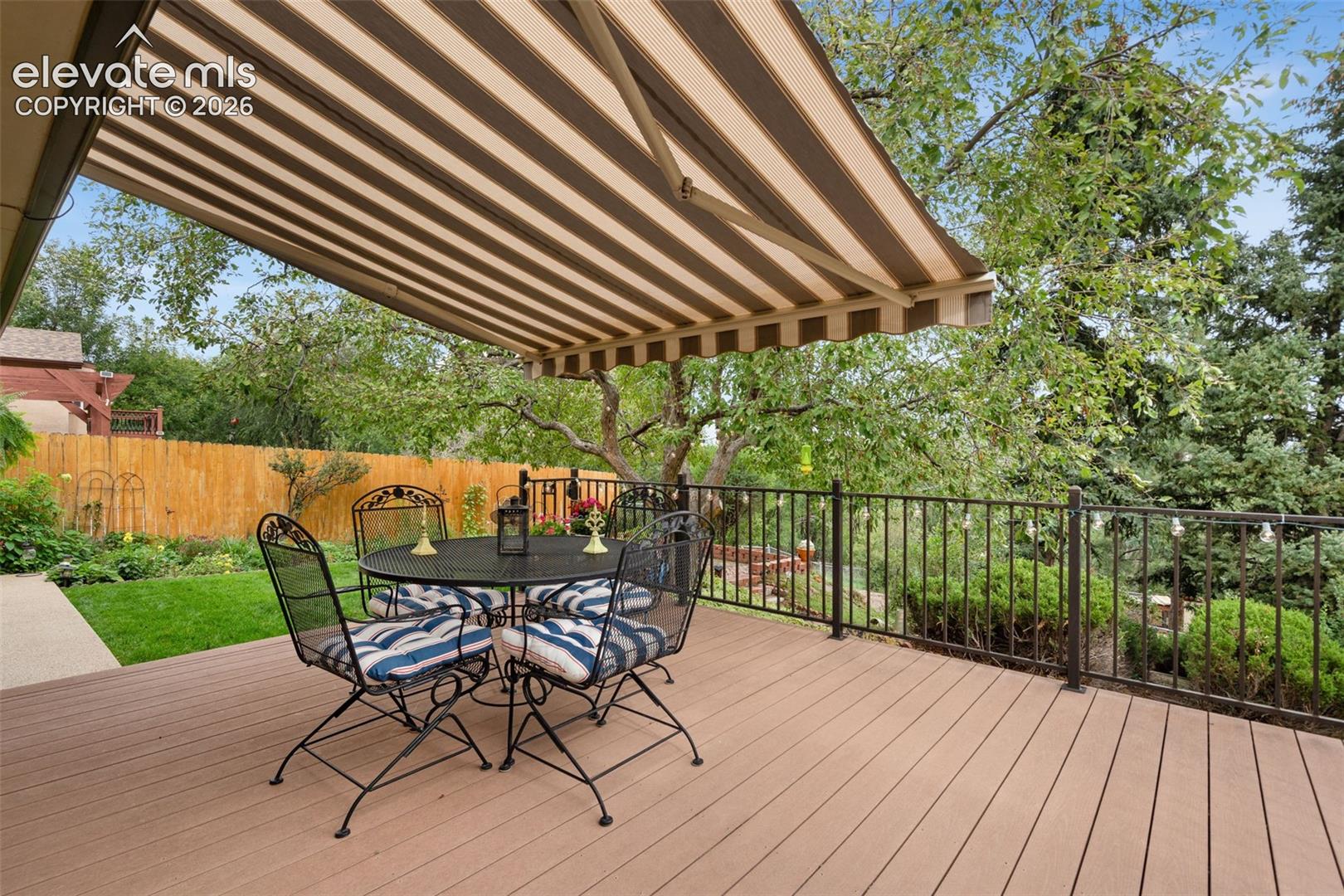 Optional Sunsetter shade to provide protection from the Colorado sun in this gorgerou private backyard