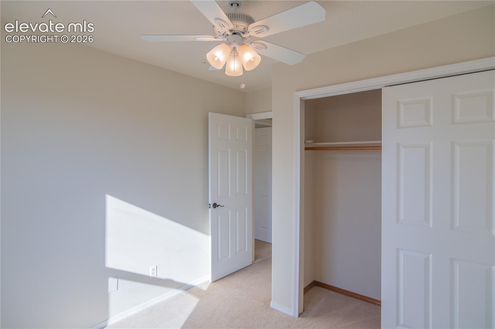 Additional view highlighting the bedroom's closet space and natural light.