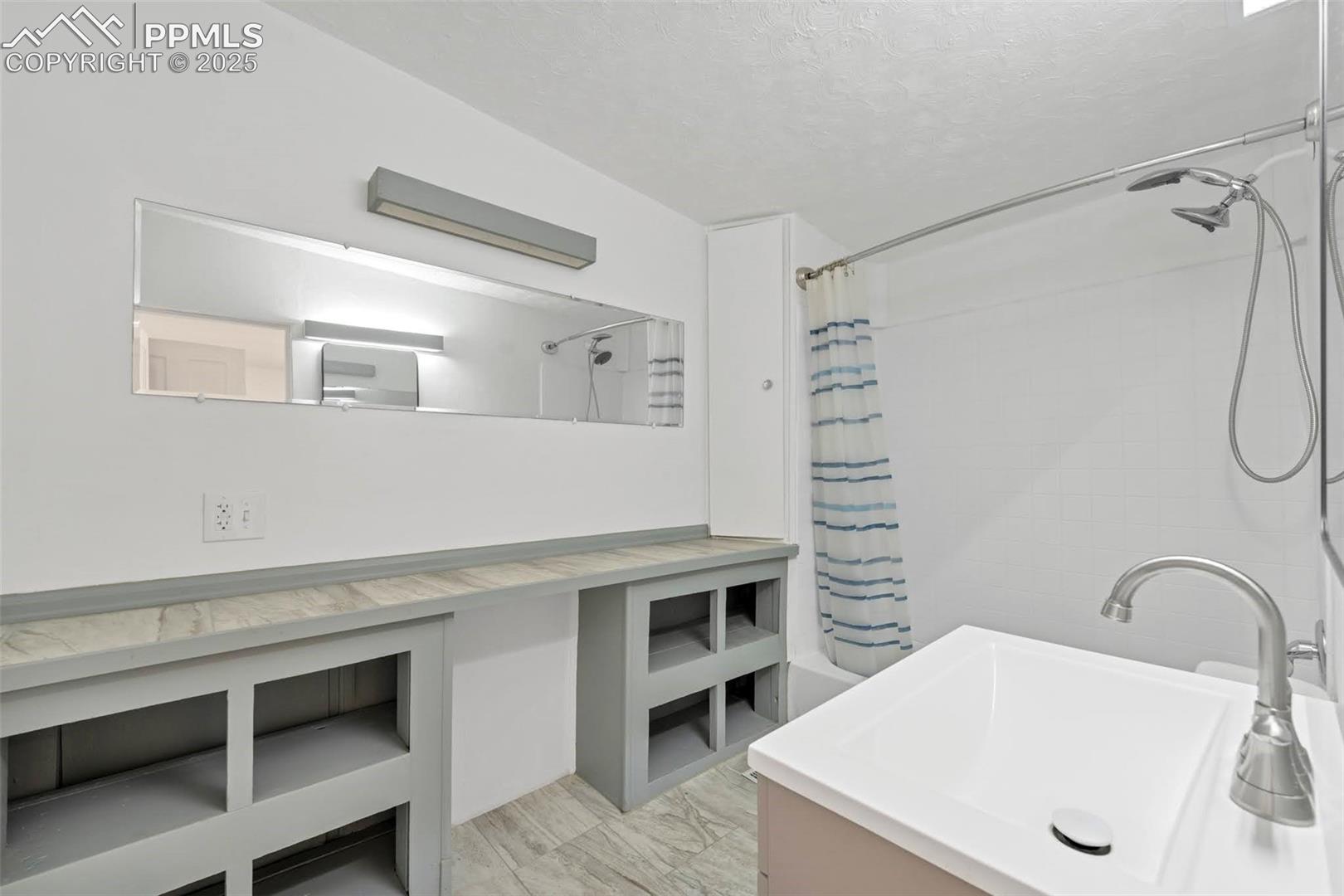 Full Bathroom with built-in shelving and fresh updated look