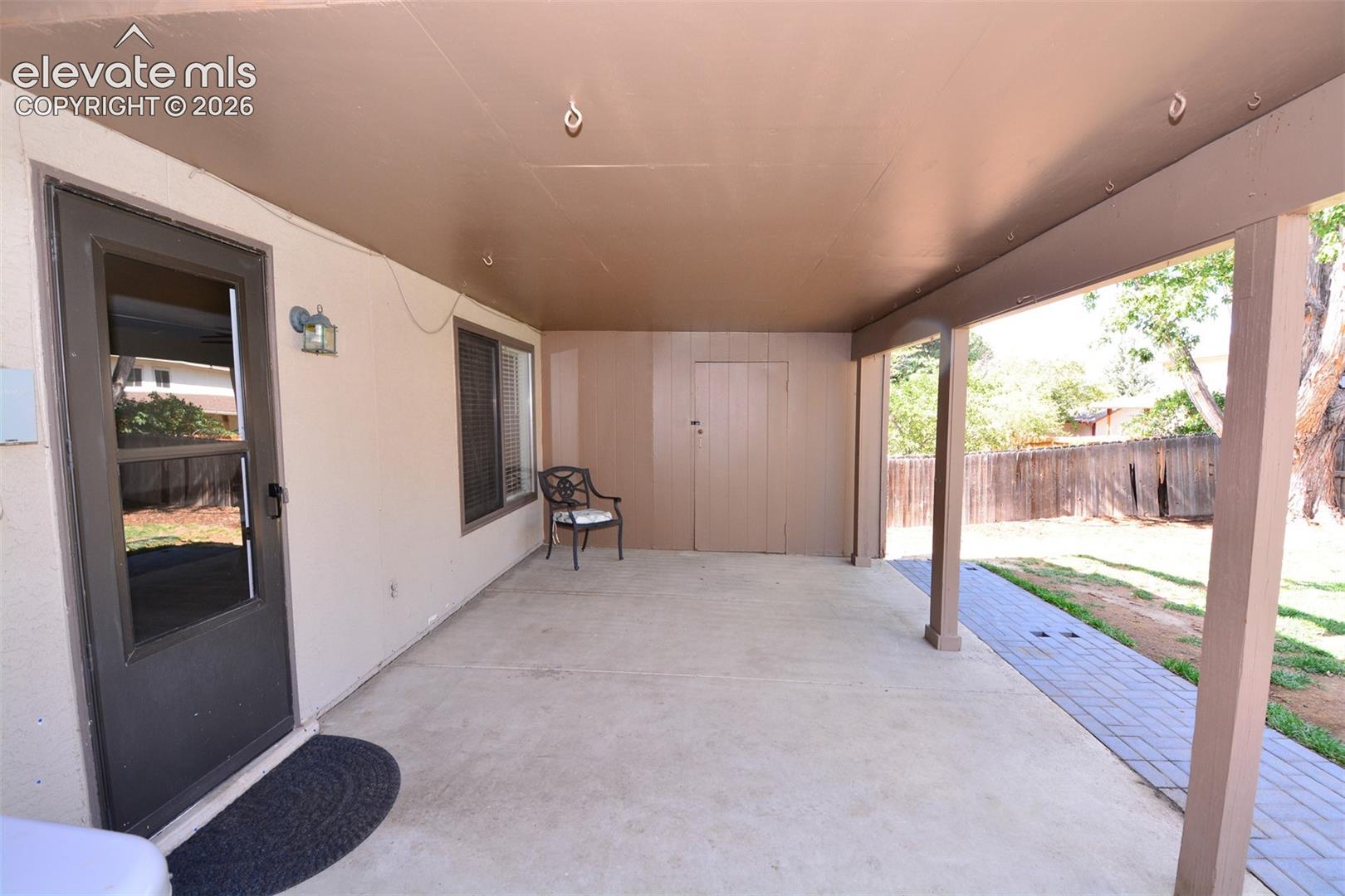 Walk-out from the lower level family room to covered patio/backyard