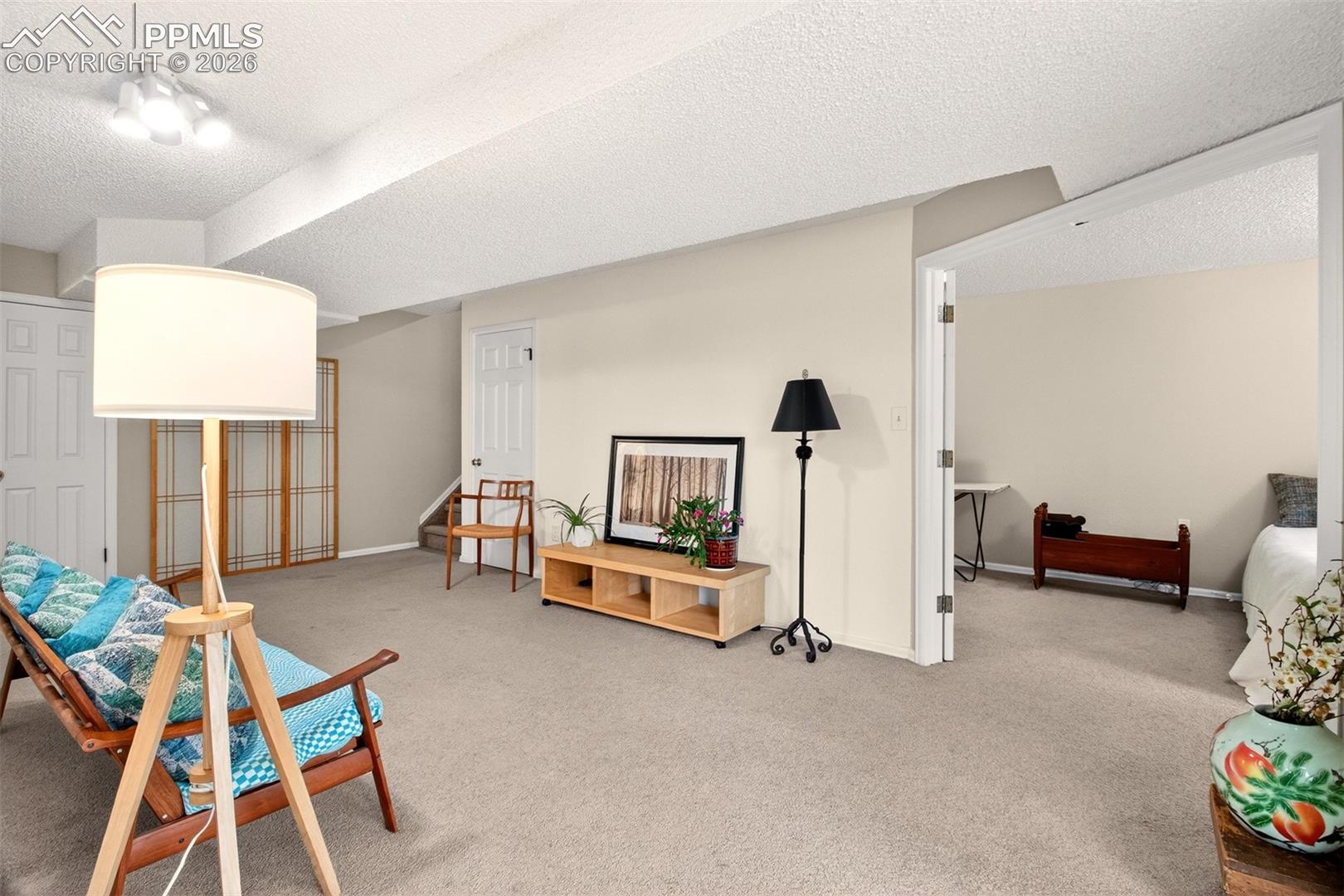 Finished basement offers a flexible family room and a private bedroom.