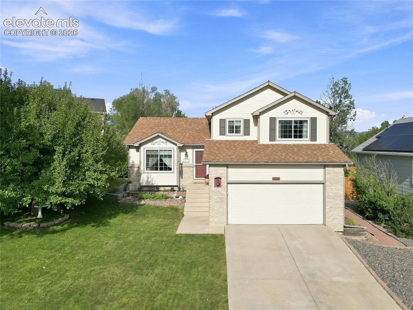 Front of house with 2 car garage