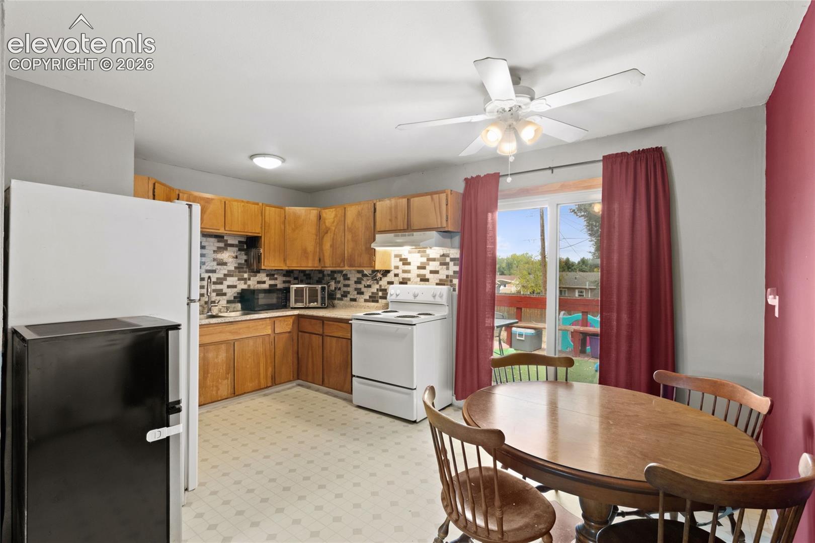 Kitchen and dining area from garage entrance