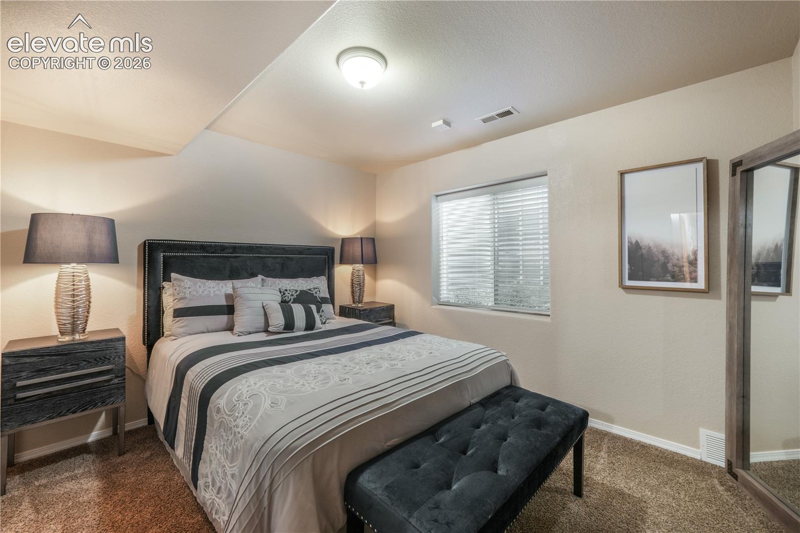 Basement Bedroom with Barn Door connecting to Second Basement Bedroom 
