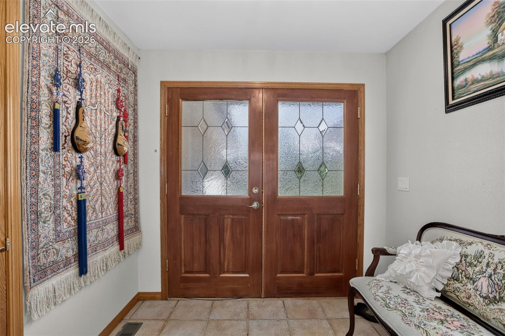 Front entrance foyer with mud room area.