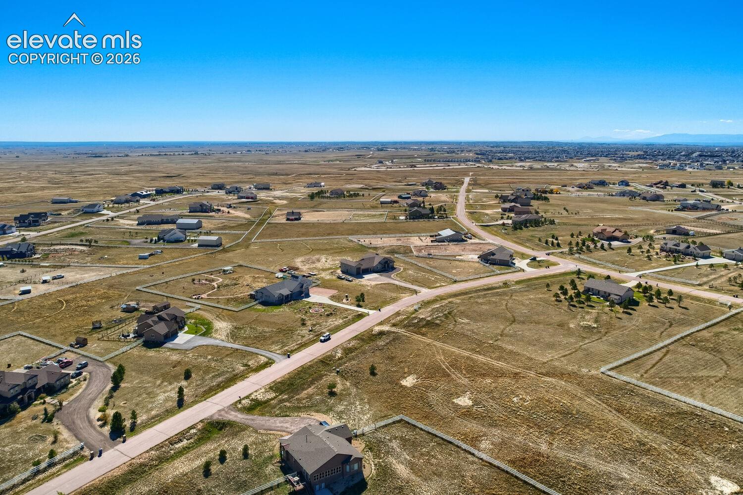 Expansive open plains setting with multiple residences