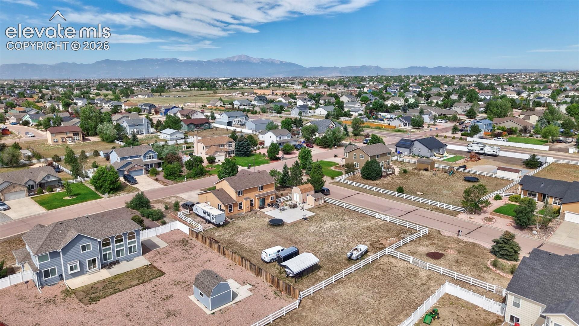 Expansive residential neighborhood with distant mountain ranges