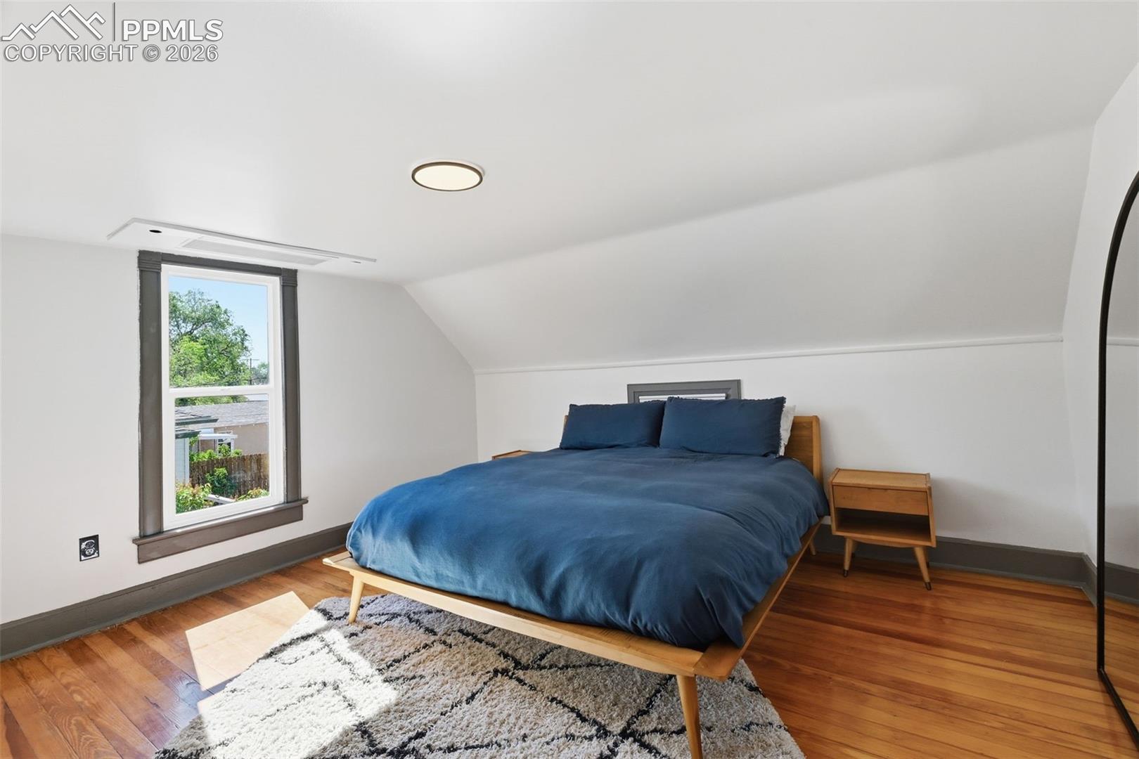 Primary suite hosts original hardwood floors, and a private 3/4 bath. 
