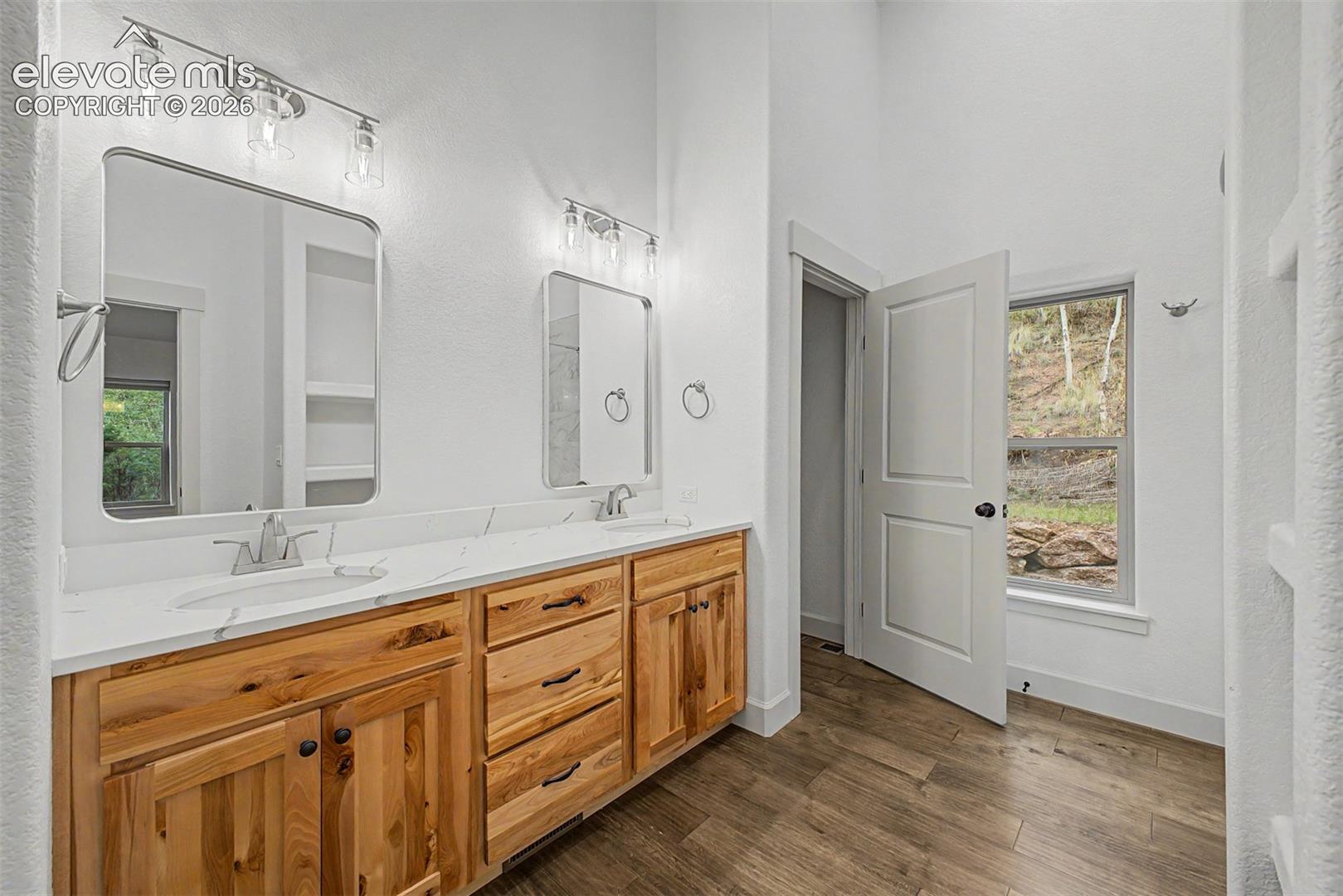 Large bath with access from hall and bedroom 2