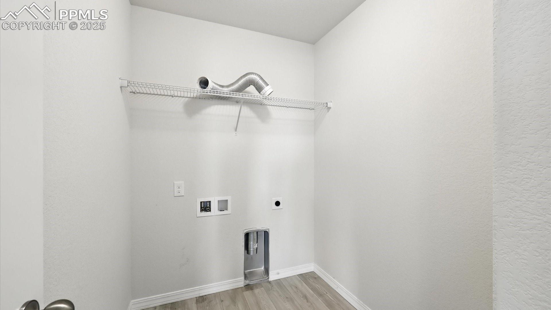 Upper Level Laundry Room with electric hookup.