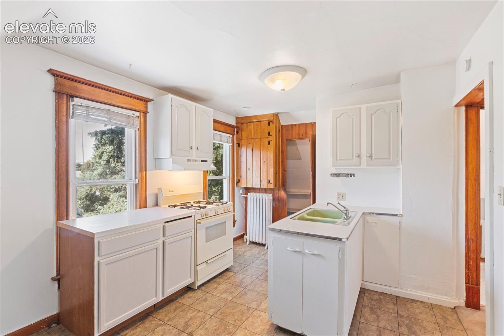 Upstairs kitchen with walk-in pantry
