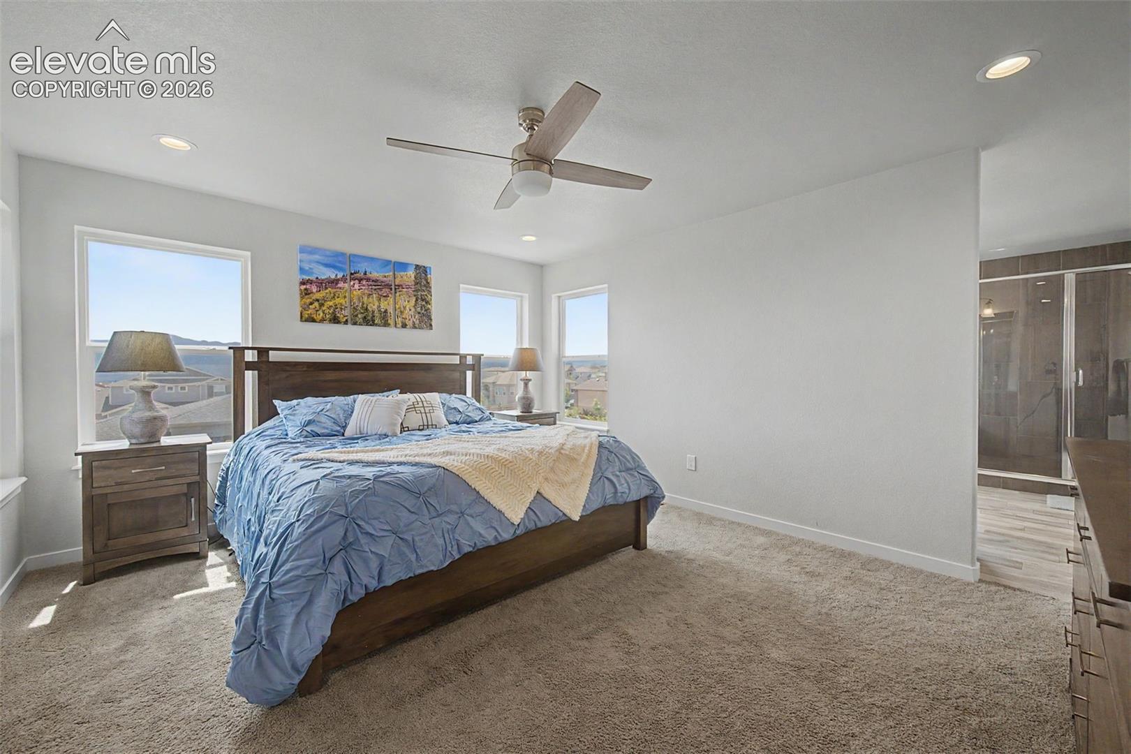 The spacious primary bedroom leads into an awesome 5-pc bath.