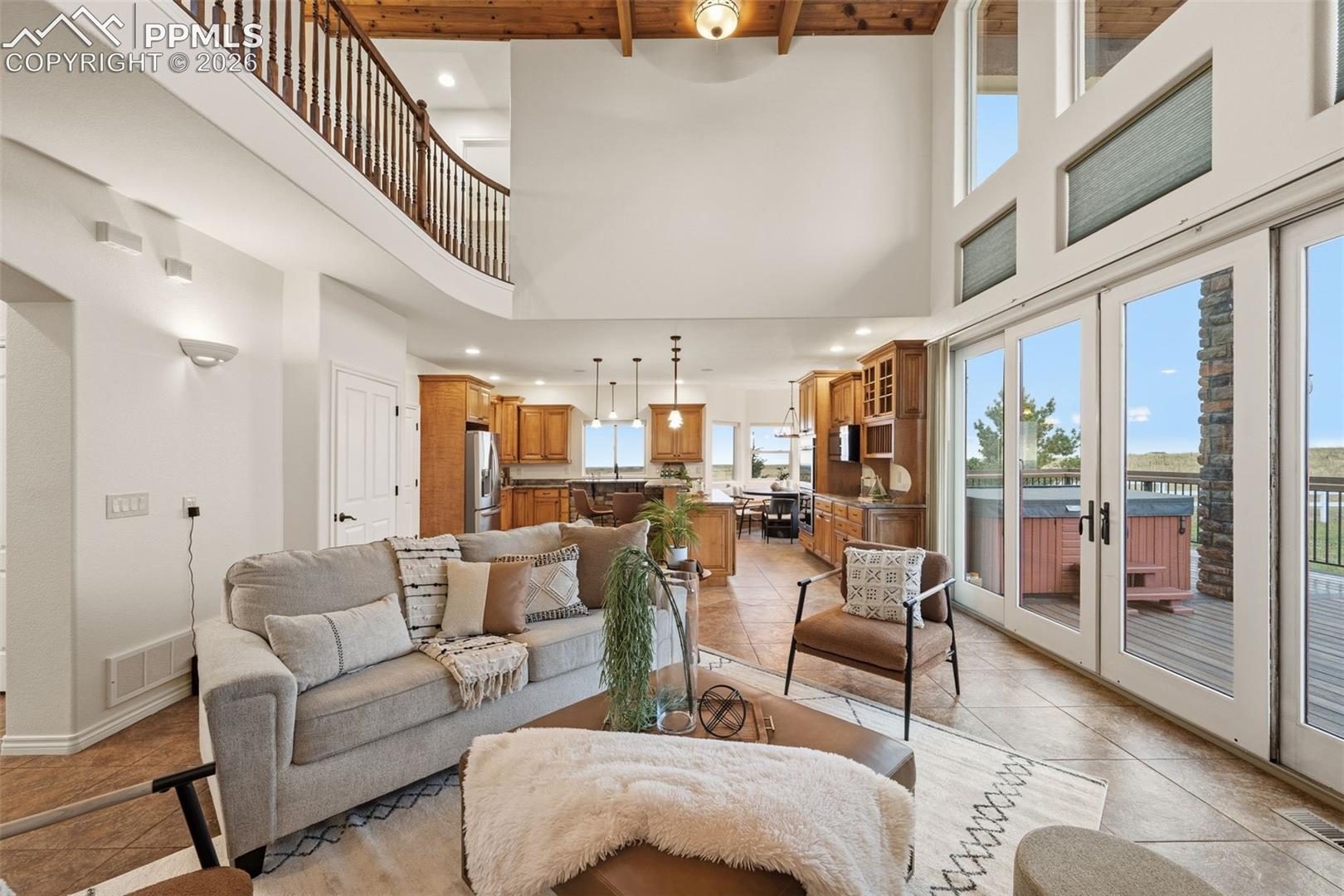 Open and spacious living room leads to the well appointed kitchen.