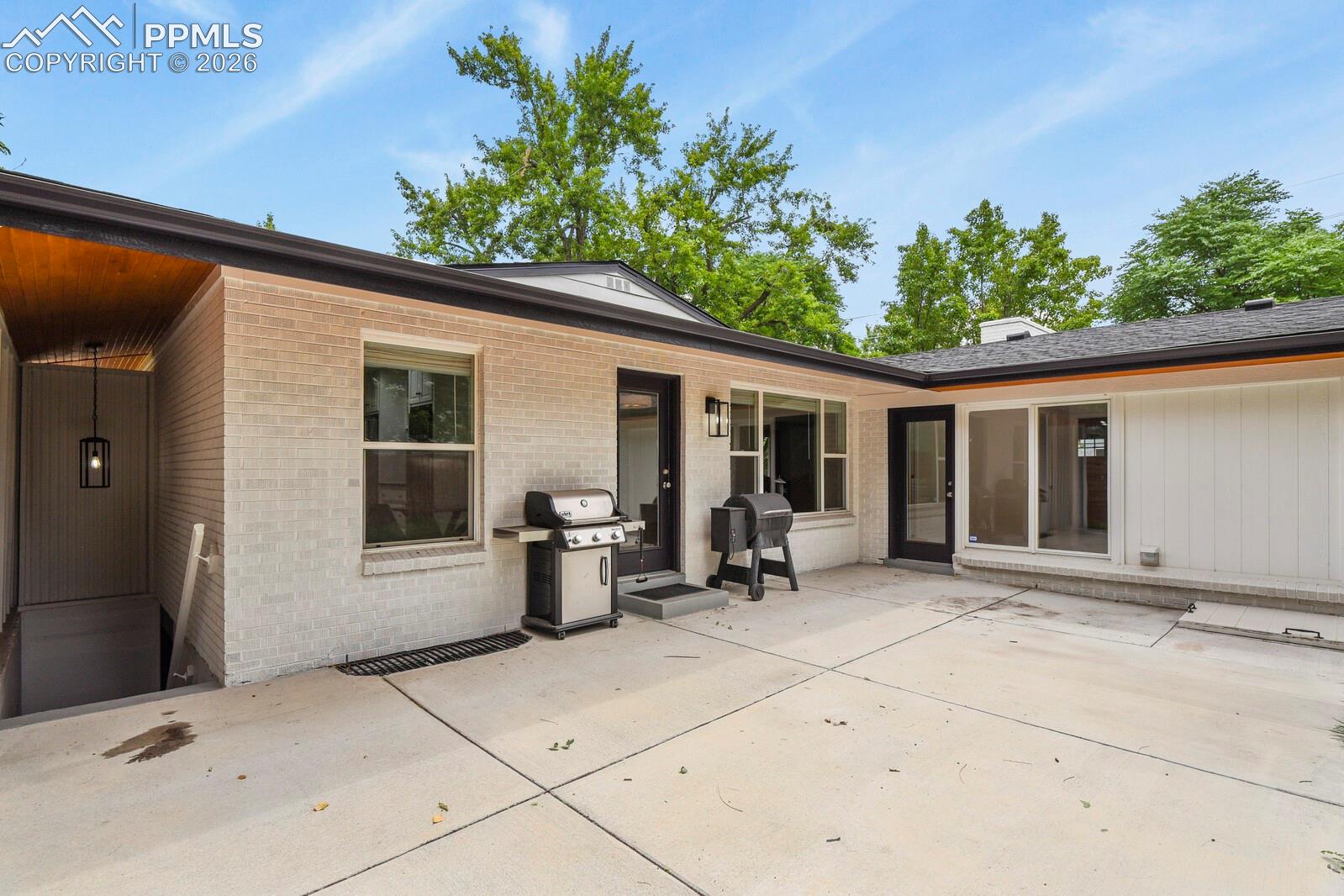 Expansive concrete patio in backyard