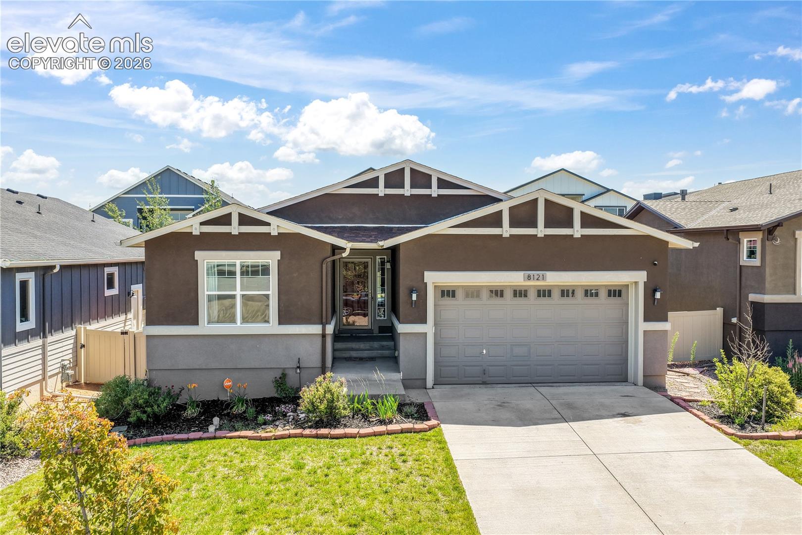 Front of home, 2 car garage, landscaping 